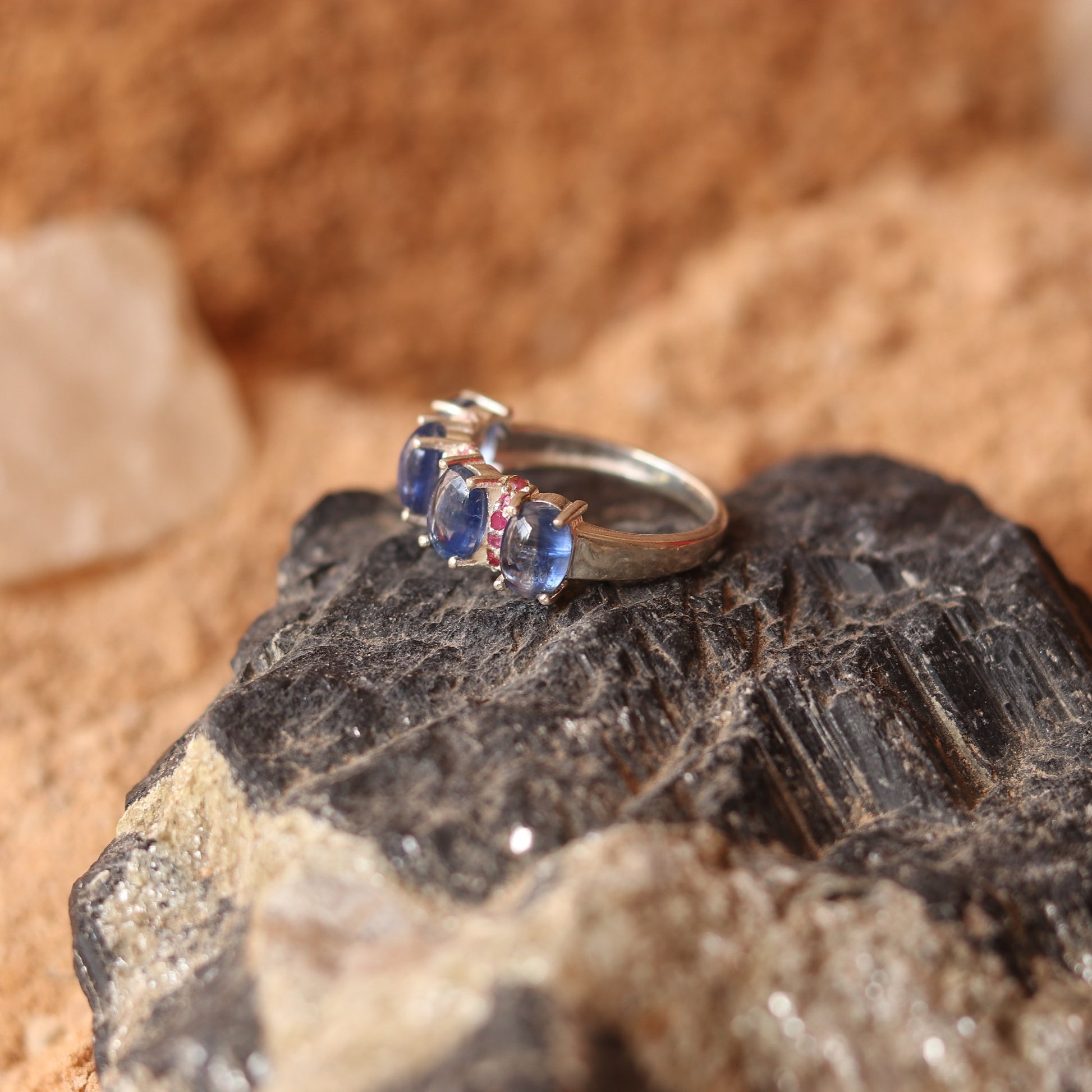 SILVER RING STUDDED WITH RUBIES AND TANZANITE