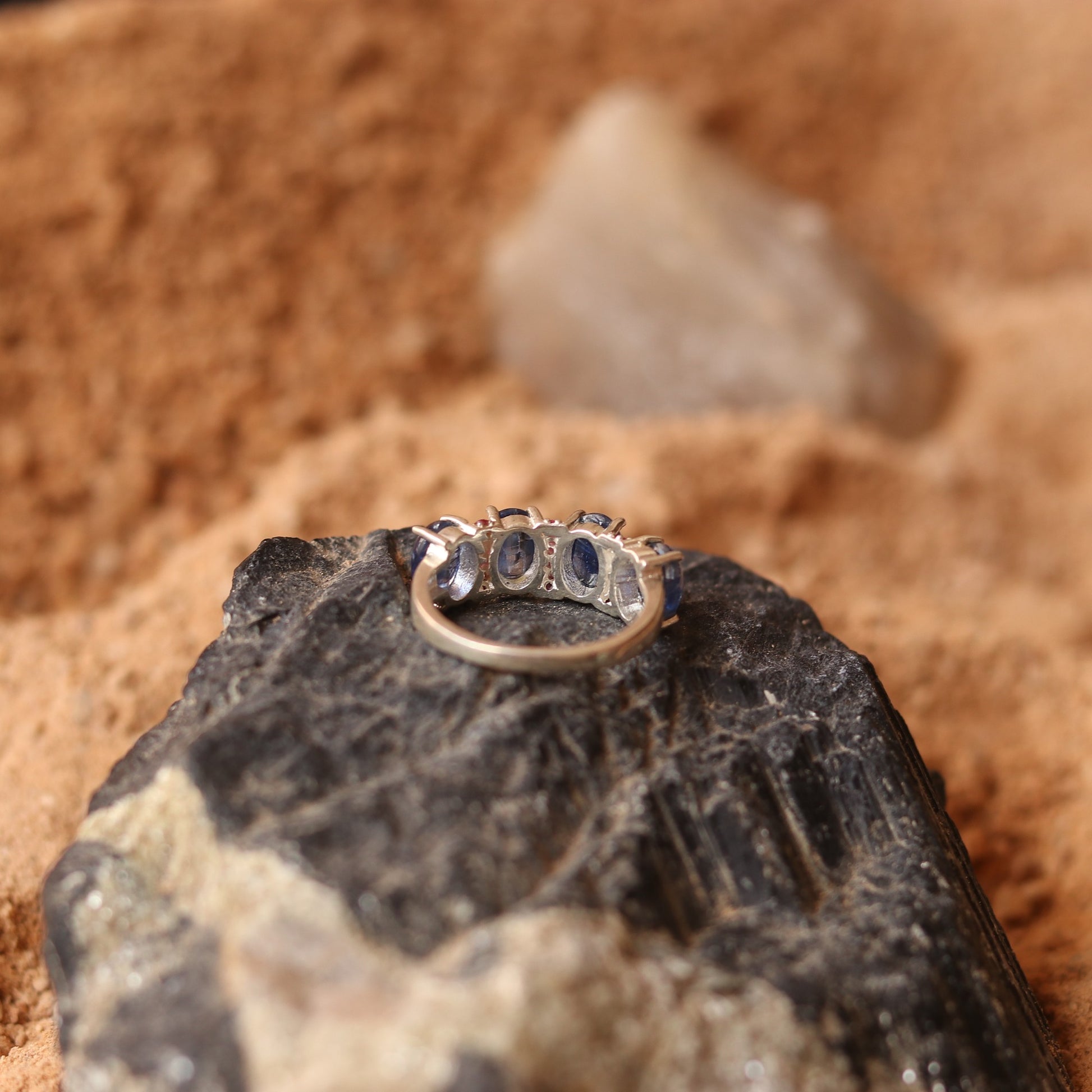 SILVER RING STUDDED WITH RUBIES AND TANZANITE