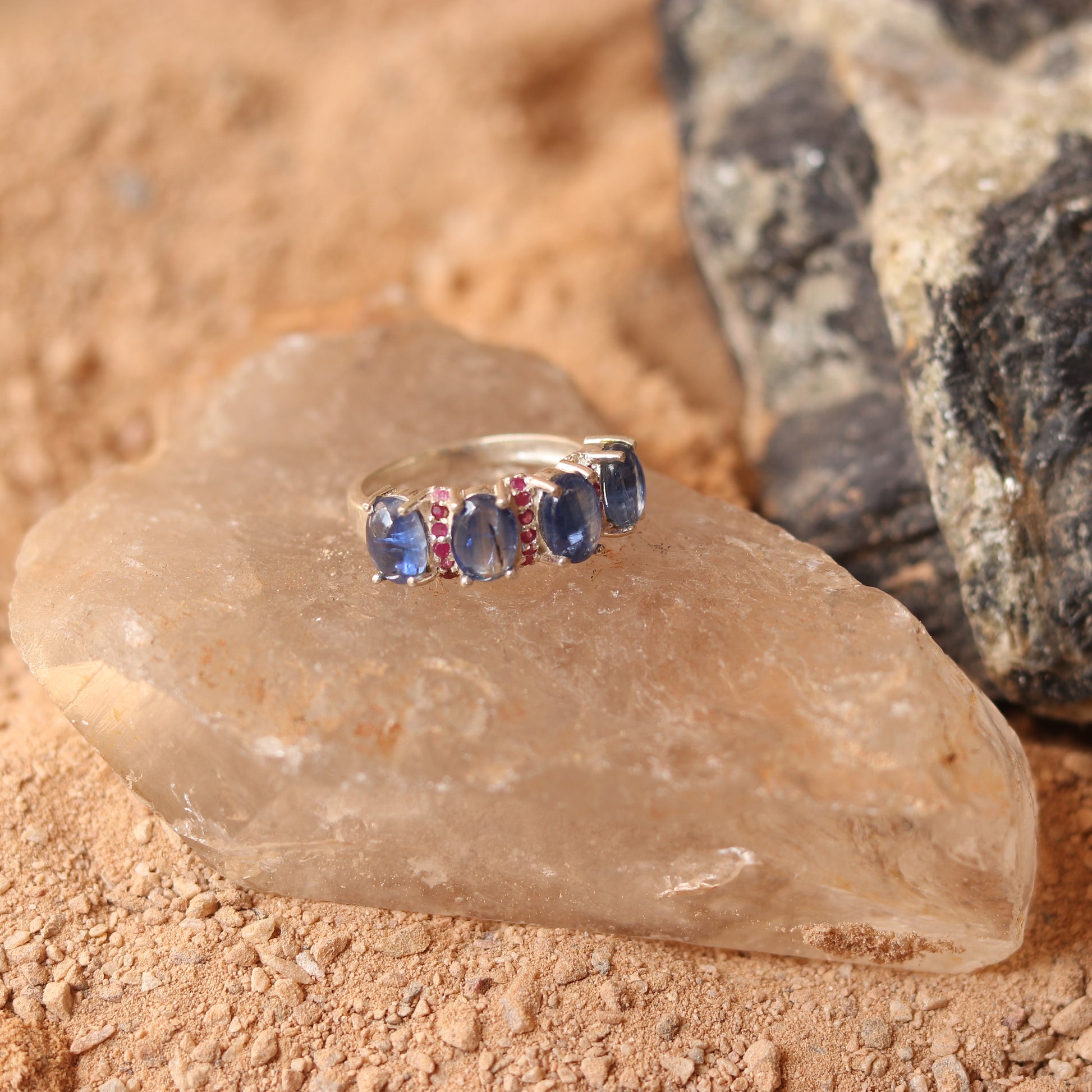 SILVER RING STUDDED WITH RUBIES AND TANZANITE