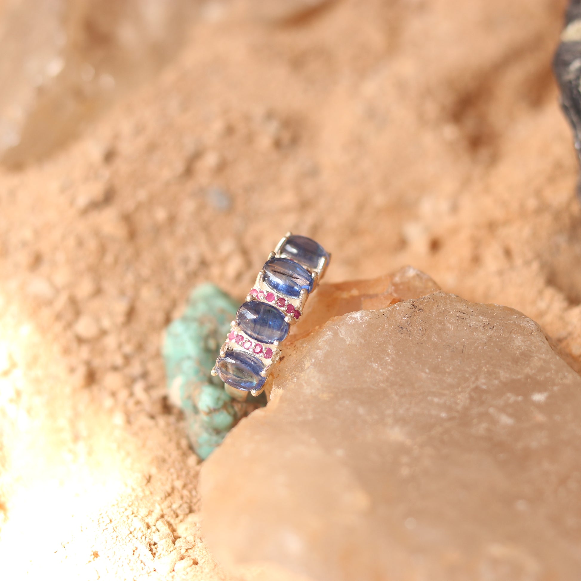 SILVER RING STUDDED WITH RUBIES AND TANZANITE