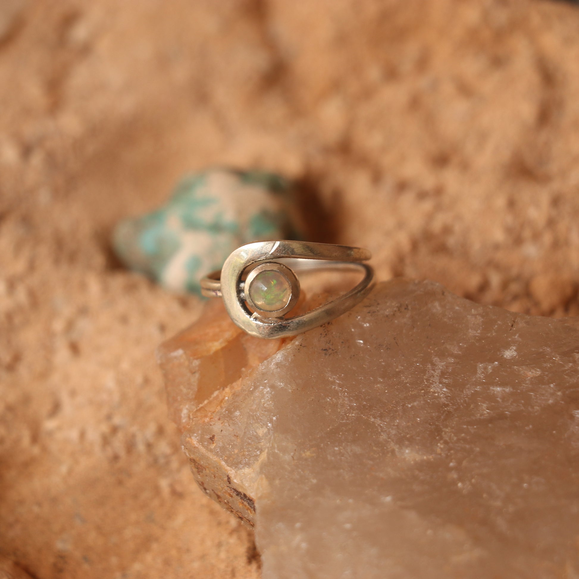 SILVER RING STUDDED WITH ETHIOPIAN OPAL