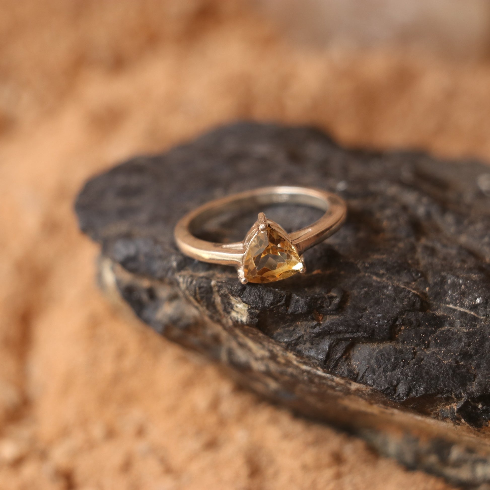 SILVER RING WITH A TRIANGULAR GOLDEN TOPAZ