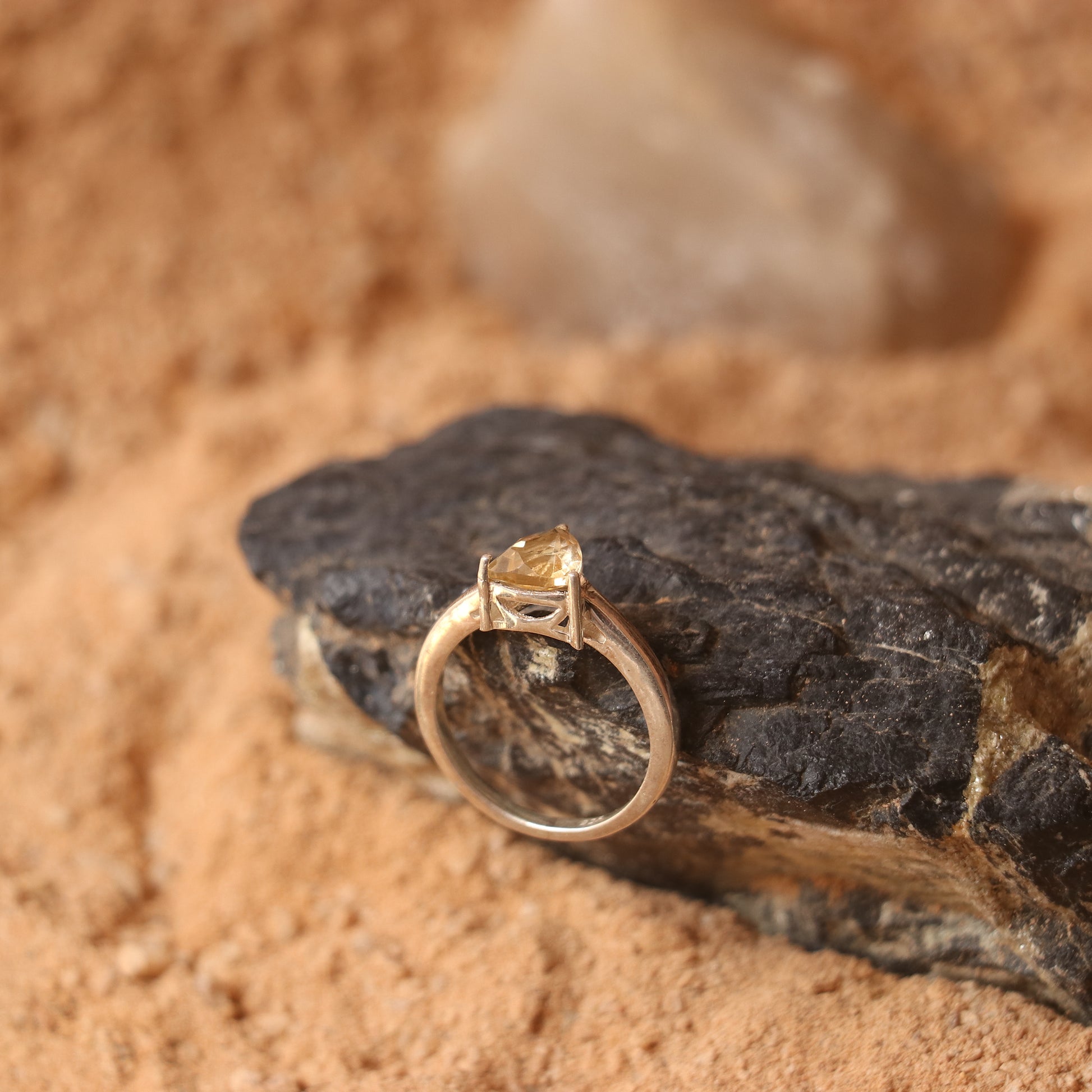 SILVER RING WITH A TRIANGULAR GOLDEN TOPAZ