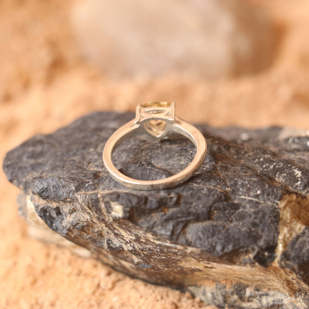 SILVER RING WITH A TRIANGULAR GOLDEN TOPAZ