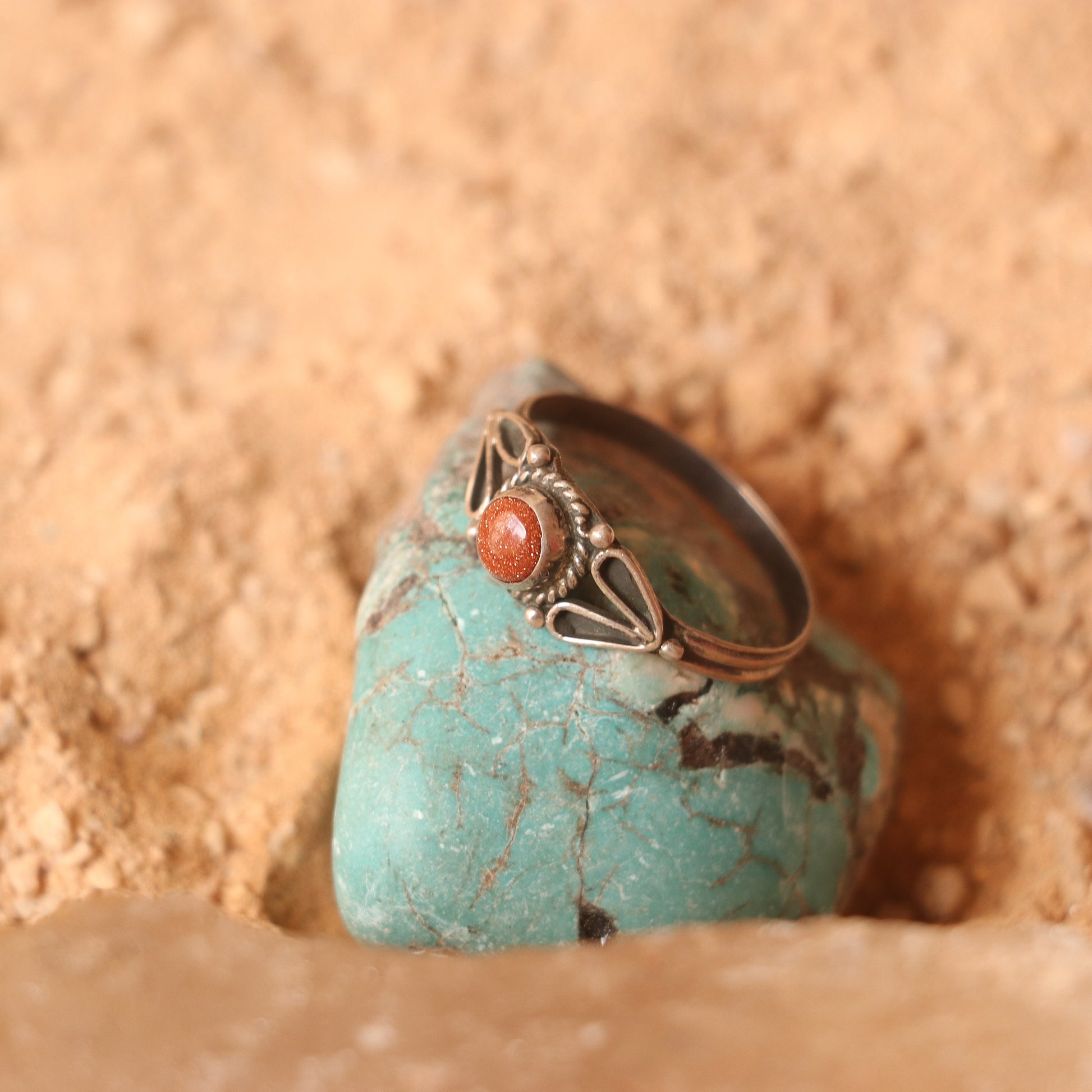 SILVER RING STUDDED WITH SUNSTONE