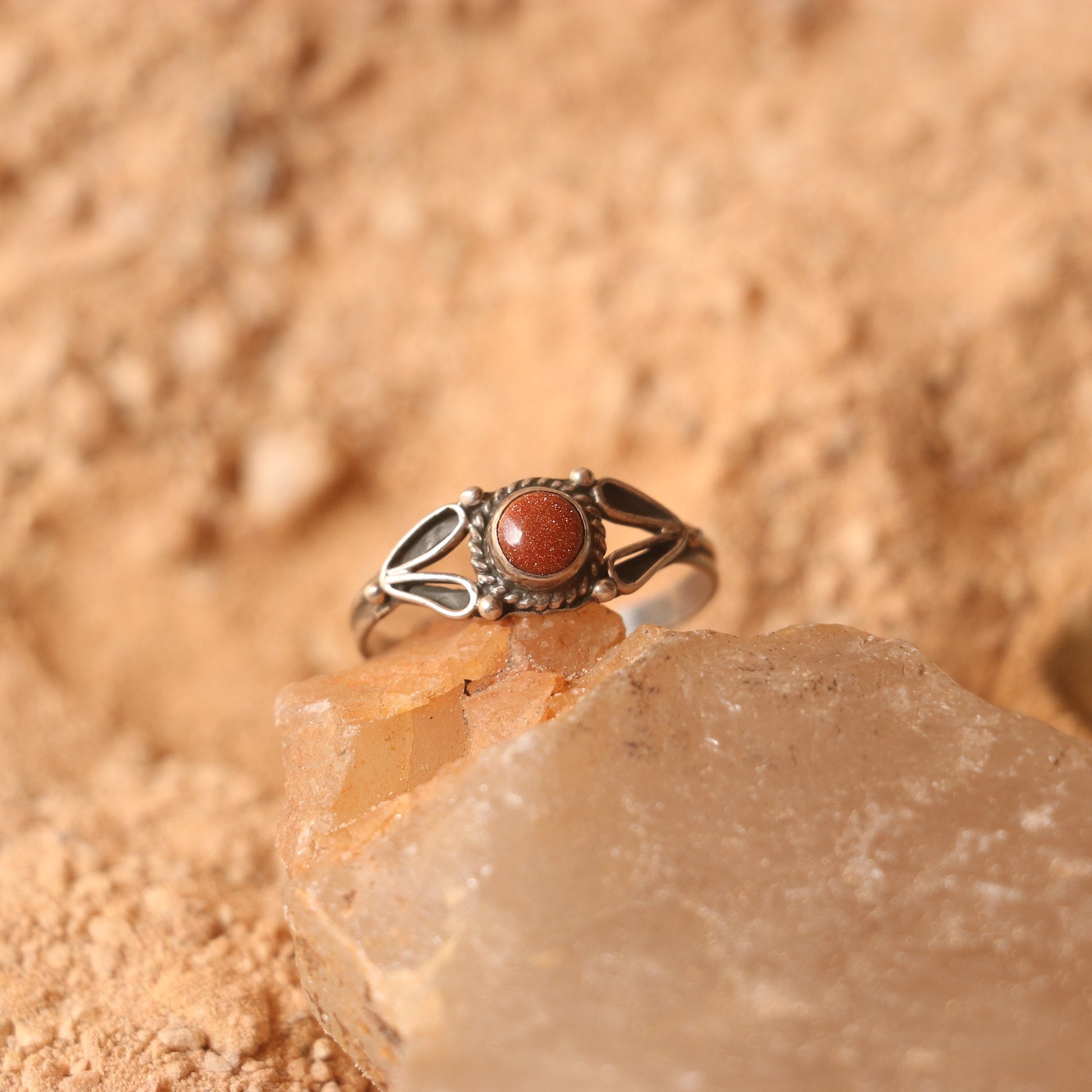 SILVER RING STUDDED WITH SUNSTONE