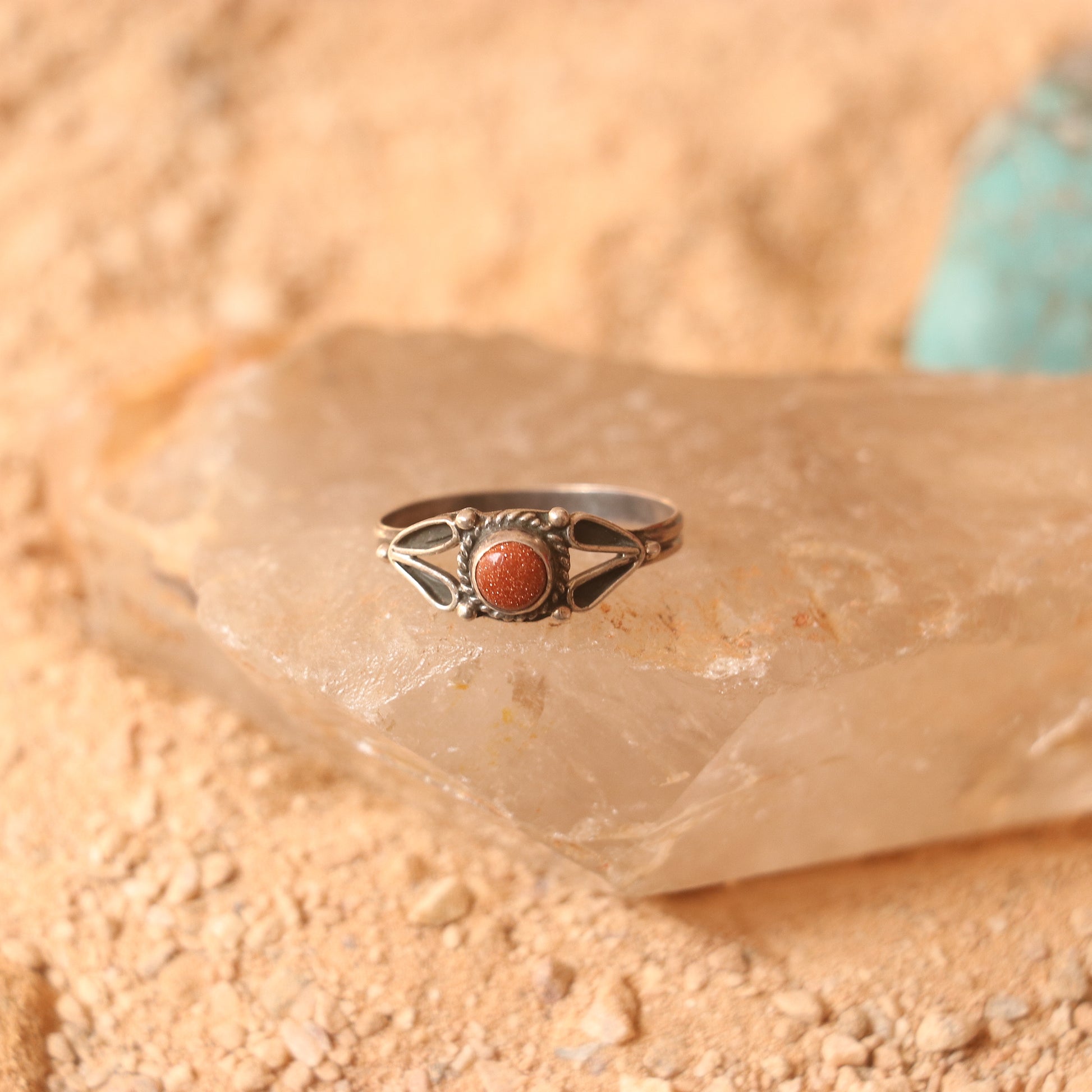 SILVER RING STUDDED WITH SUNSTONE