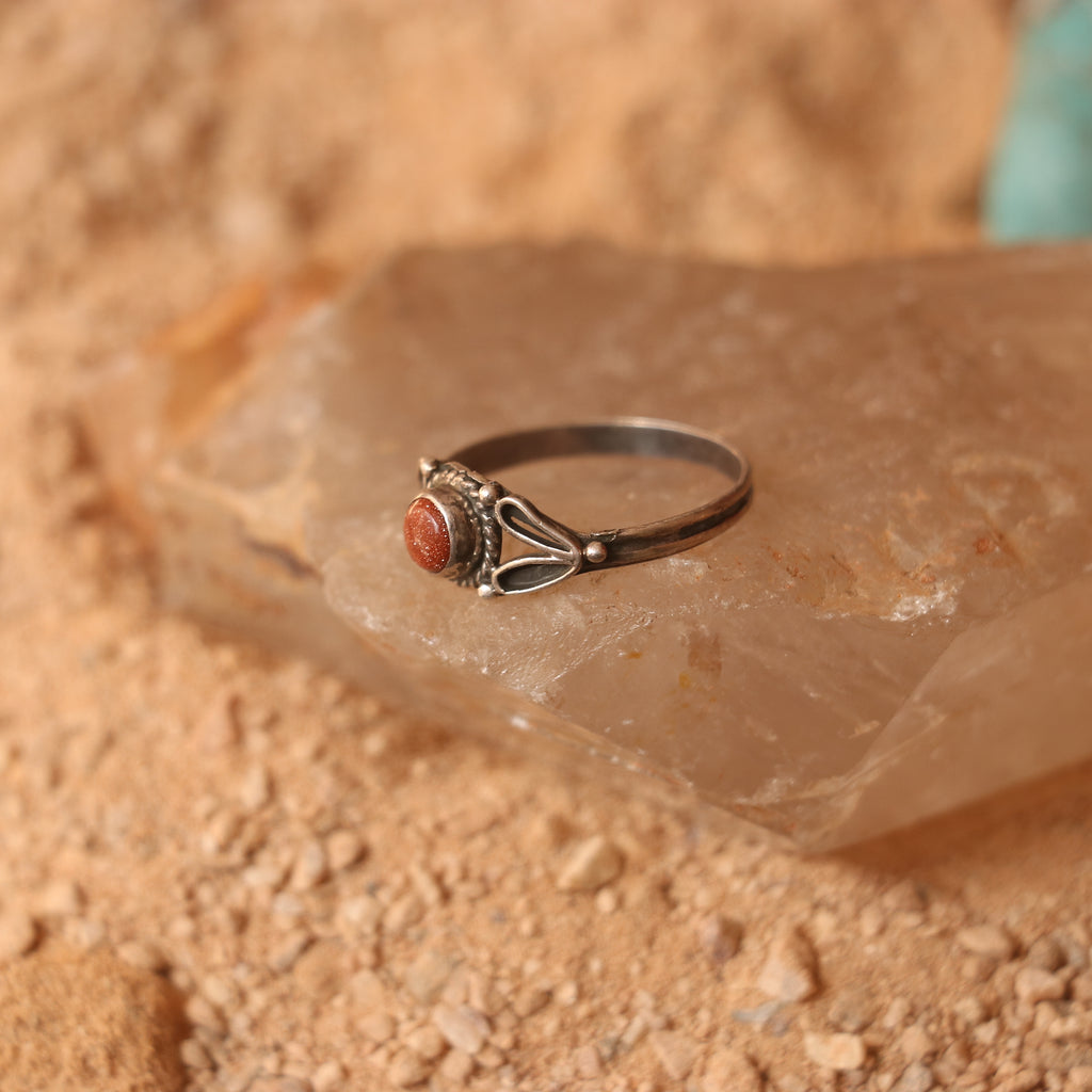 SILVER RING STUDDED WITH SUNSTONE