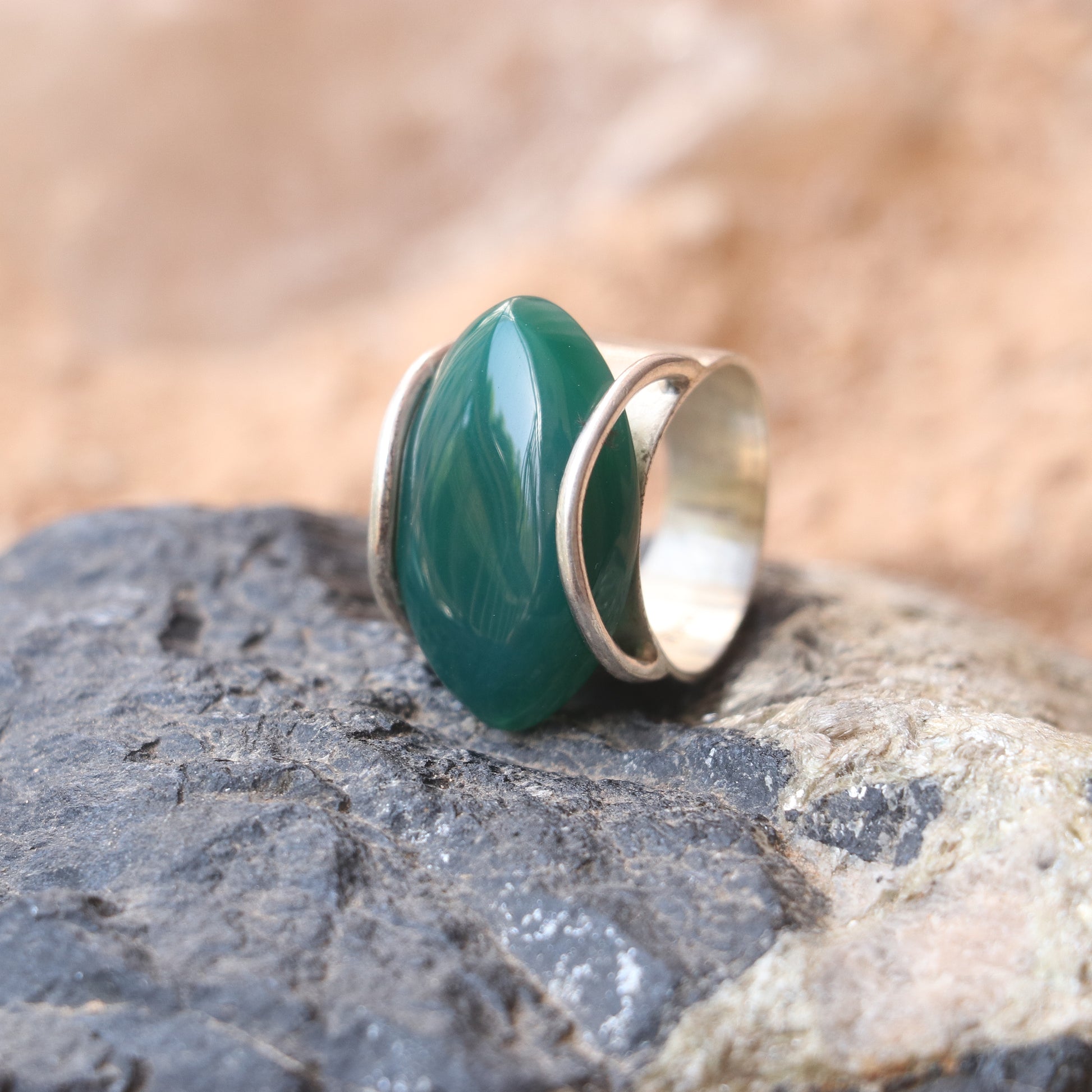 SILVER RING WITH LARGE GREEN ONYX IN A WRAP DESIGN