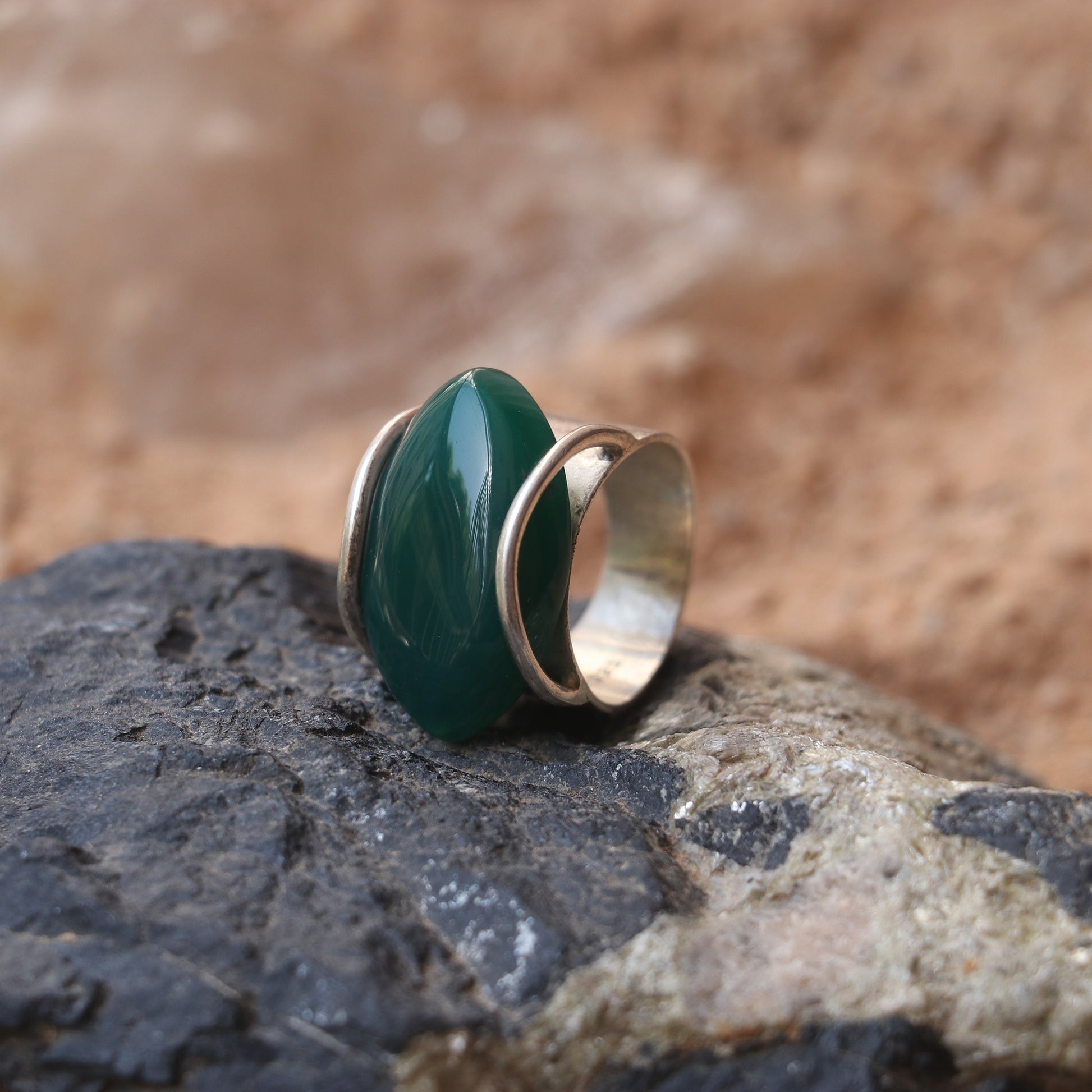 SILVER RING WITH LARGE GREEN ONYX IN A WRAP DESIGN