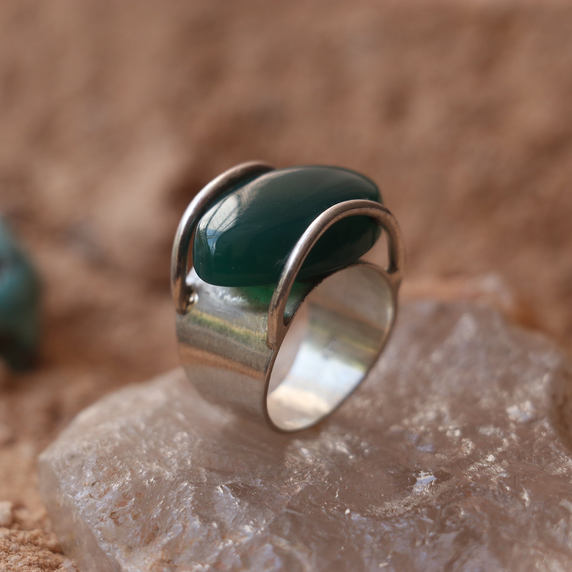 SILVER RING WITH LARGE GREEN ONYX IN A WRAP DESIGN