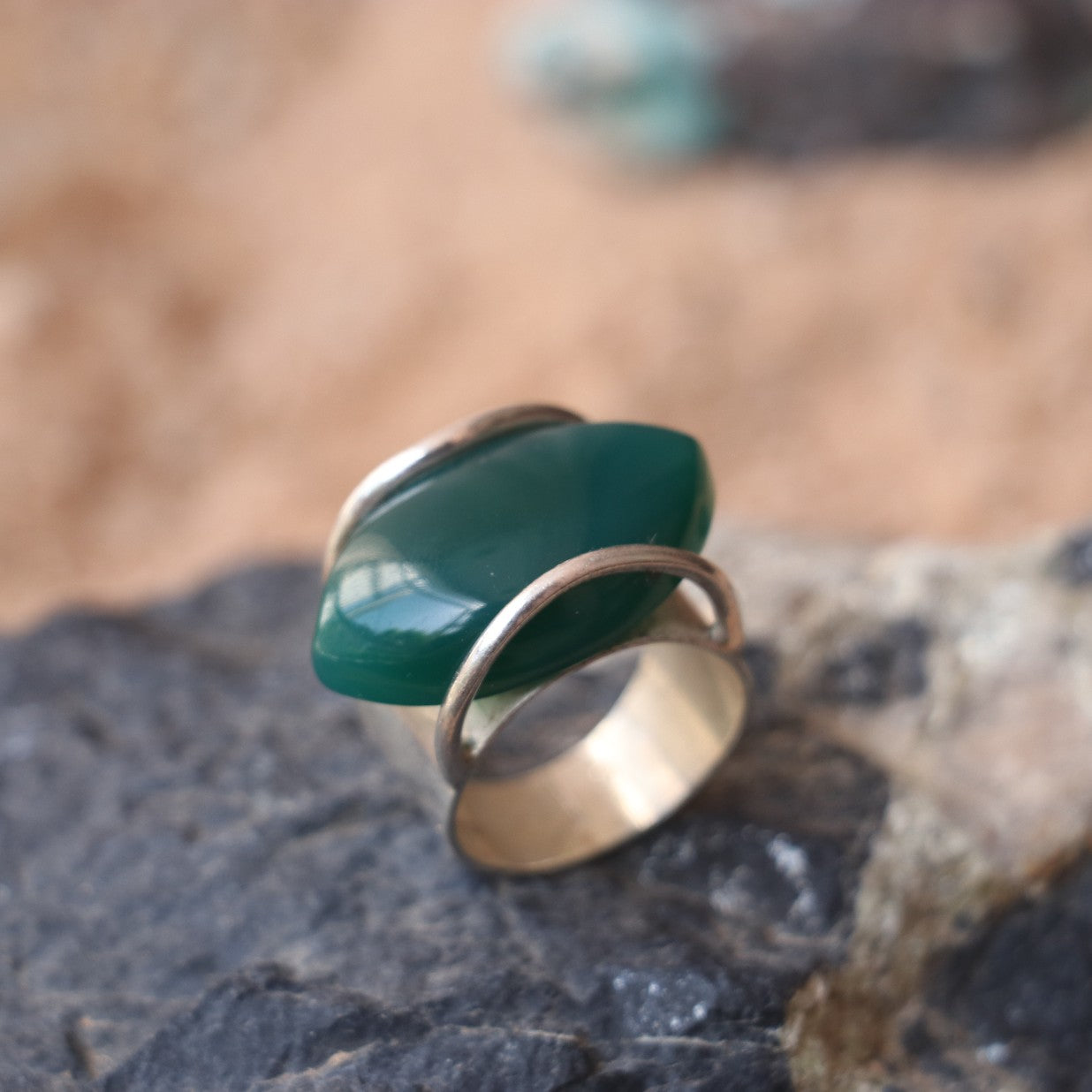 SILVER RING WITH LARGE GREEN ONYX IN A WRAP DESIGN