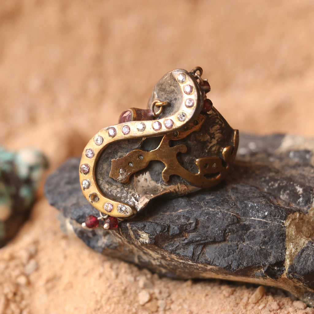 ANTIQUE SILVER RING WITH GOLD DETAILING AND STUDDED WITH RUBIES