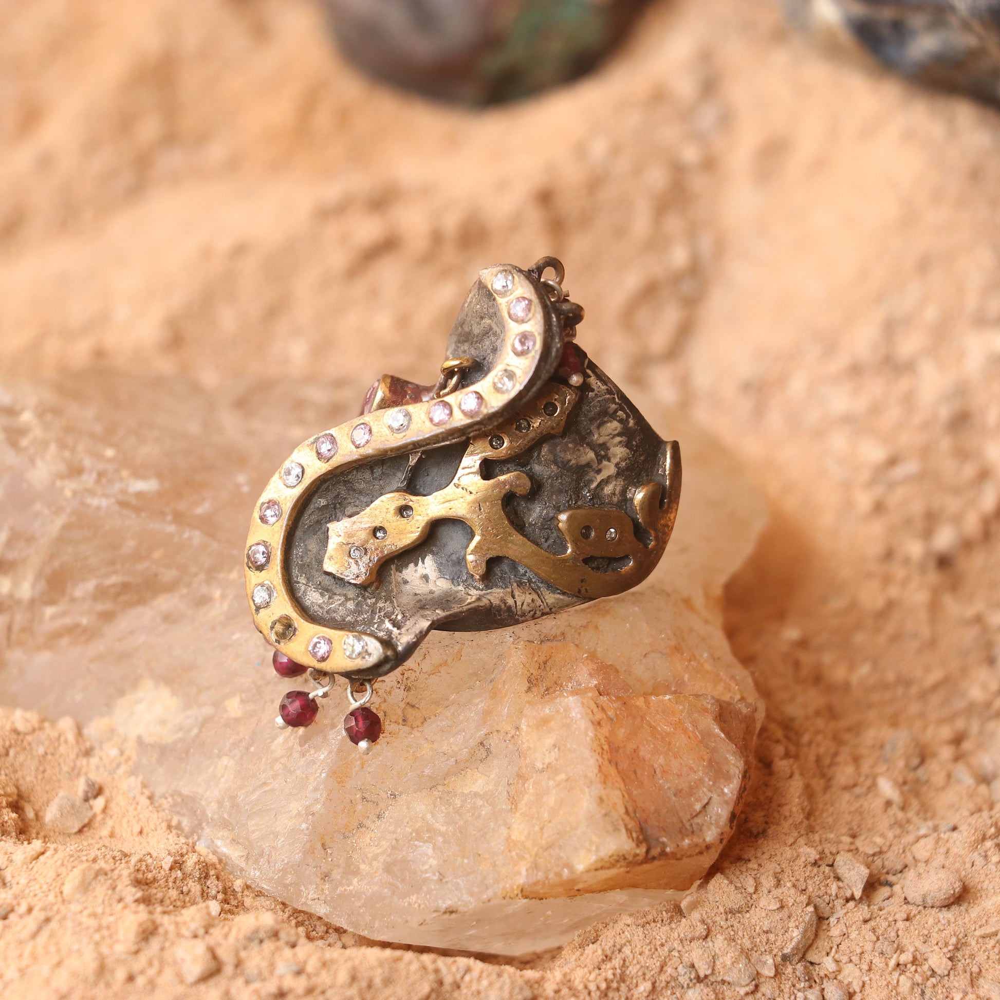 ANTIQUE SILVER RING WITH GOLD DETAILING AND STUDDED WITH RUBIES