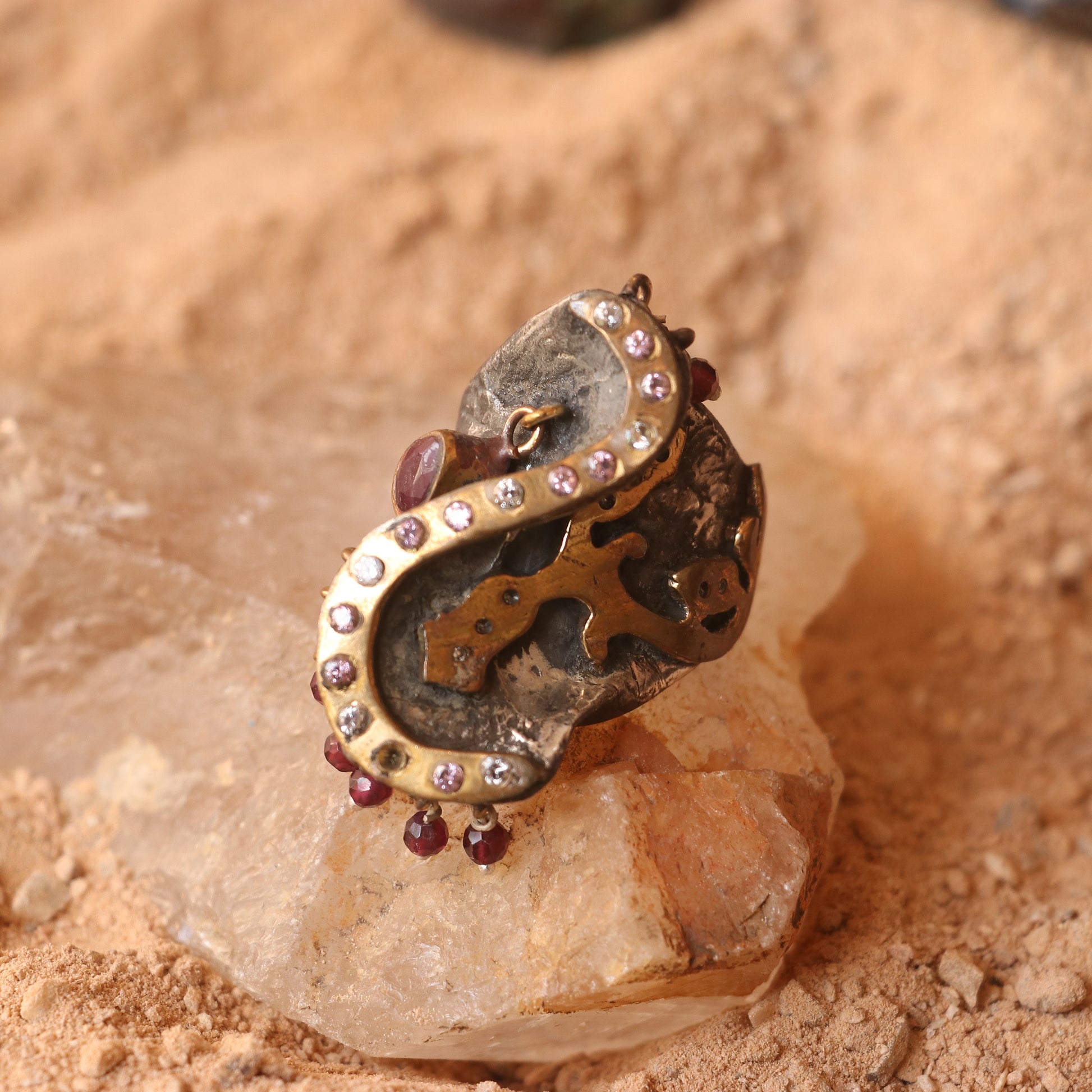 ANTIQUE SILVER RING WITH GOLD DETAILING AND STUDDED WITH RUBIES