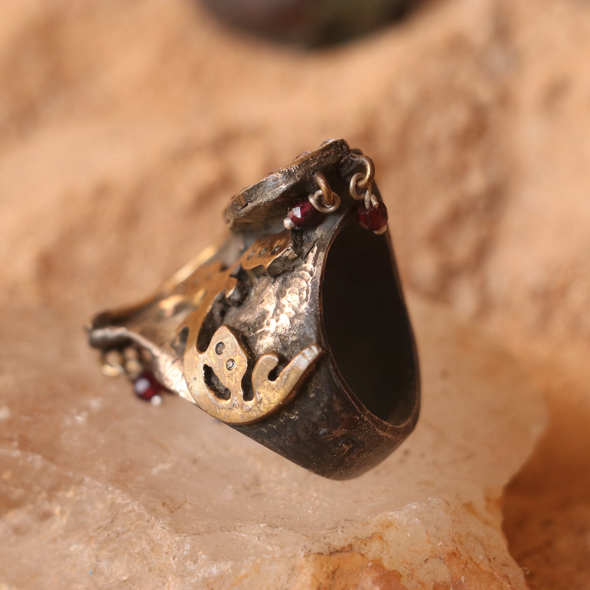 ANTIQUE SILVER RING WITH GOLD DETAILING AND STUDDED WITH RUBIES