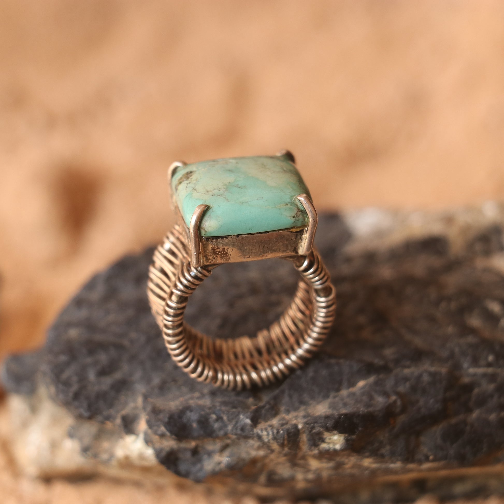 SILVER WIRE WRAPPED RING FEATURING A TURQUOISE