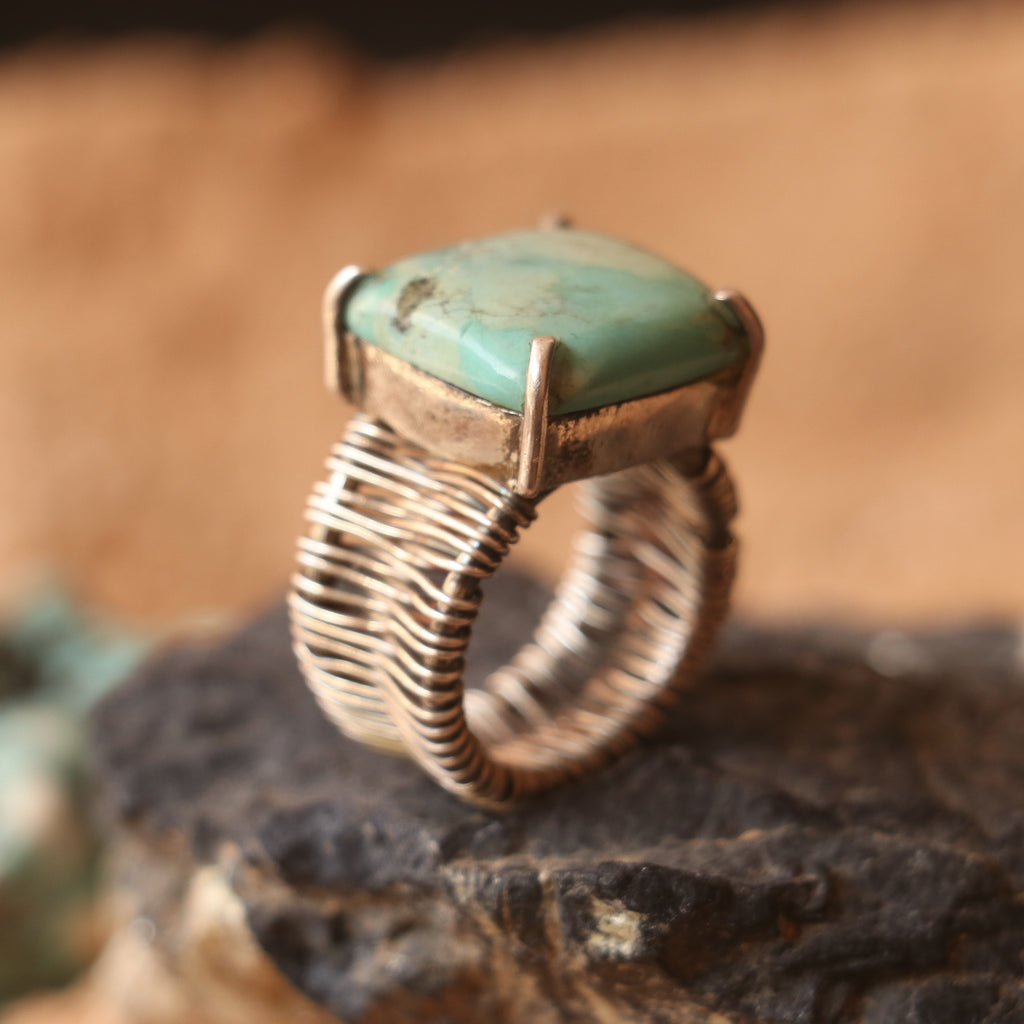 SILVER WIRE WRAPPED RING FEATURING A TURQUOISE