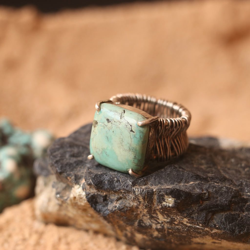 SILVER WIRE WRAPPED RING FEATURING A TURQUOISE