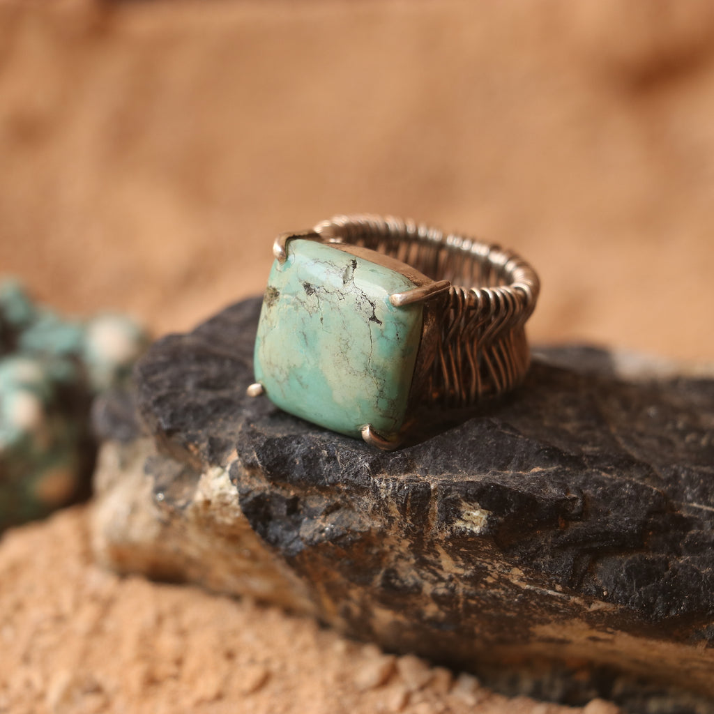 SILVER WIRE WRAPPED RING FEATURING A TURQUOISE