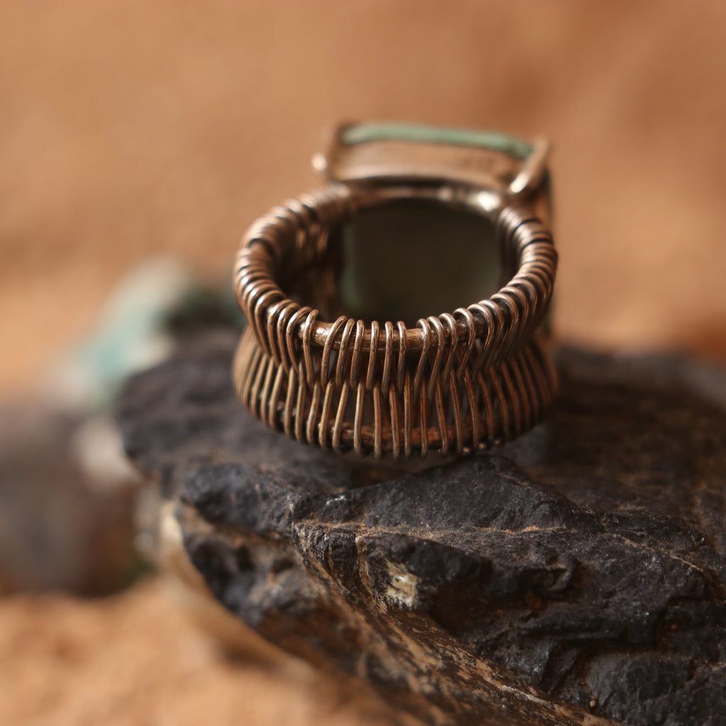 SILVER WIRE WRAPPED RING FEATURING A TURQUOISE
