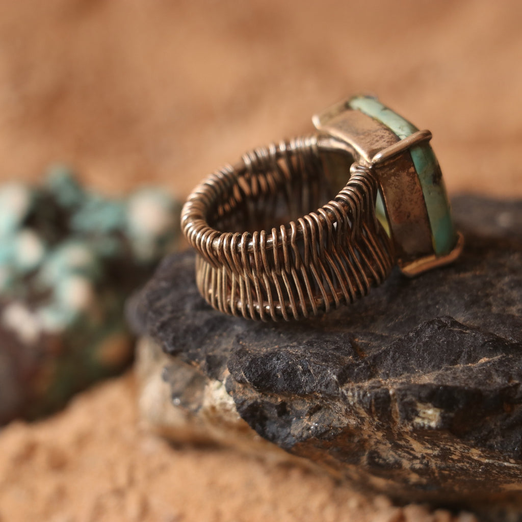SILVER WIRE WRAPPED RING FEATURING A TURQUOISE