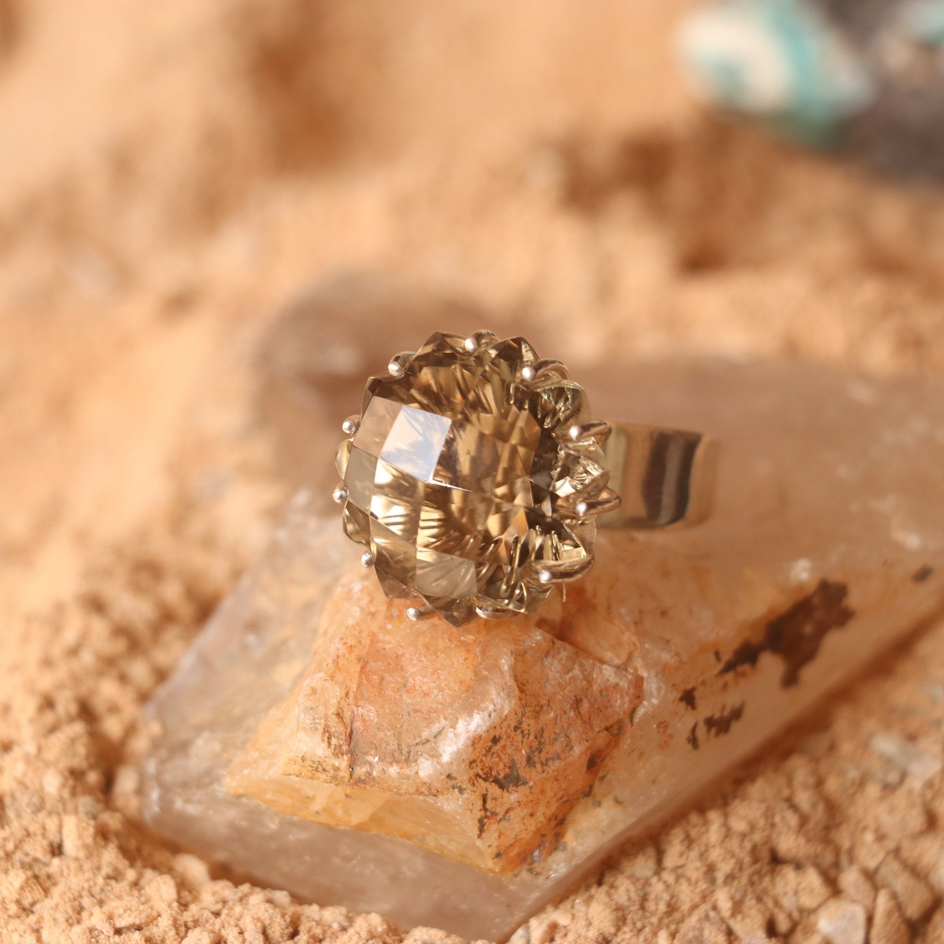SILVER RING FEATURING A LARGE GOLDEN TOPAZ