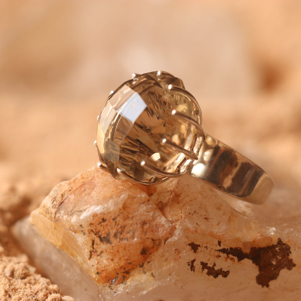 SILVER RING FEATURING A LARGE GOLDEN TOPAZ