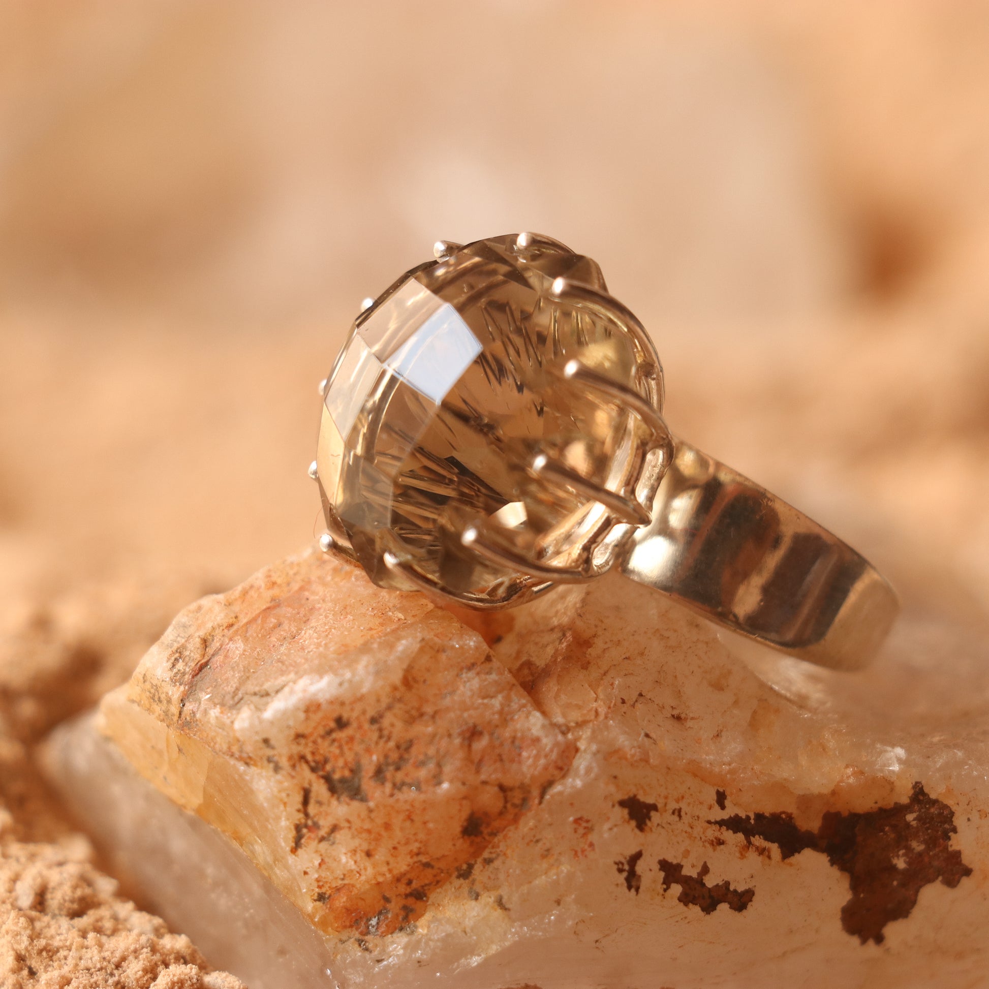 SILVER RING FEATURING A LARGE GOLDEN TOPAZ