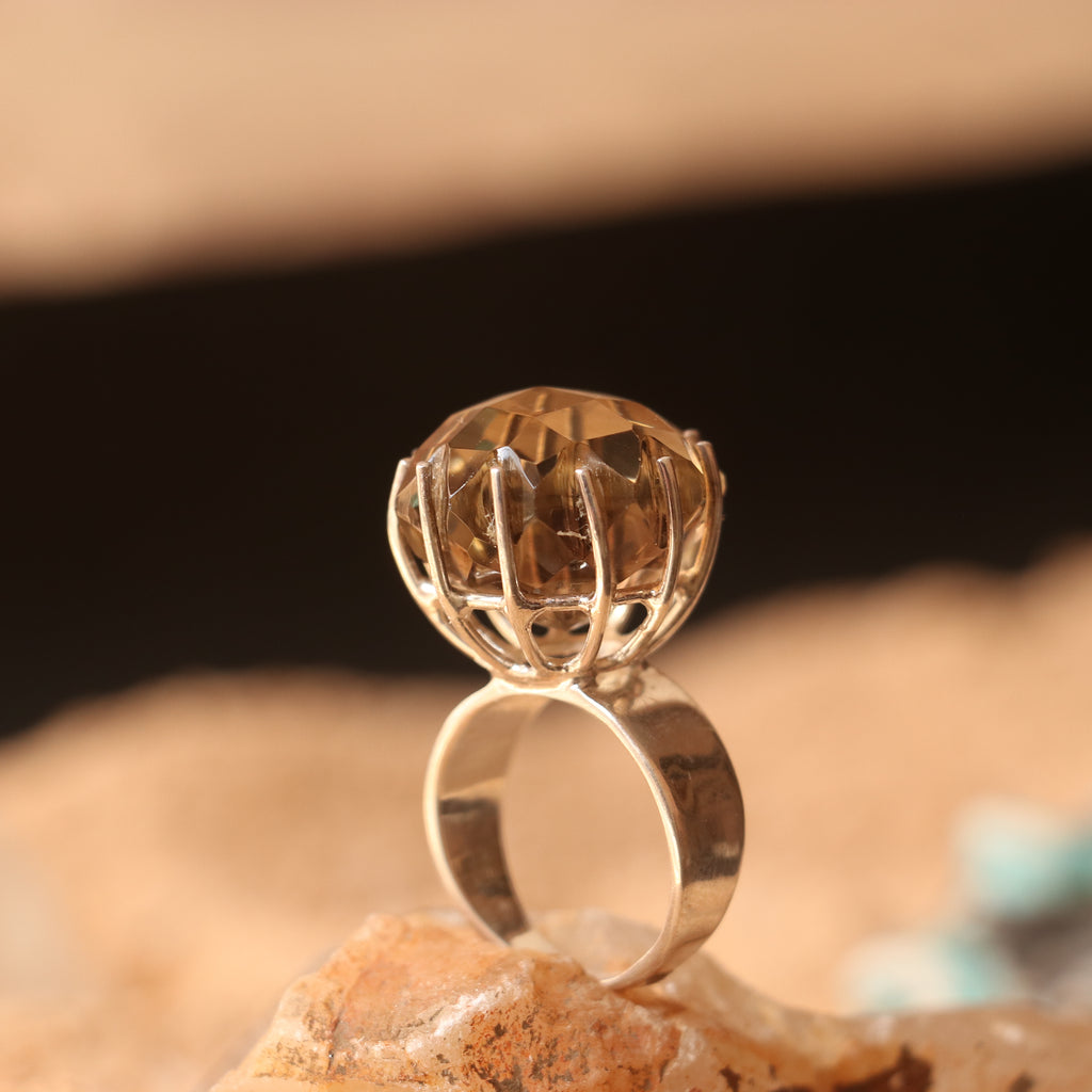 SILVER RING FEATURING A LARGE GOLDEN TOPAZ