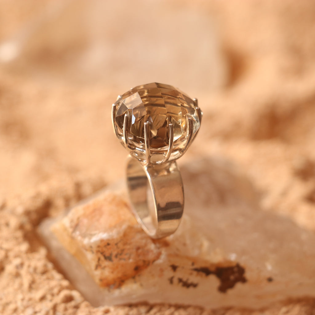 SILVER RING FEATURING A LARGE GOLDEN TOPAZ