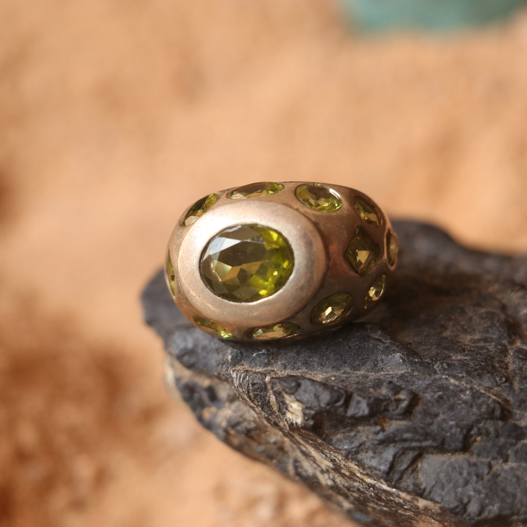 SILVER RING FEATURING MULTIPLE PERIDOTS