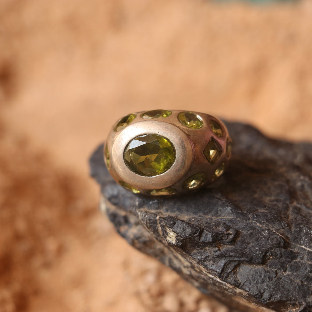 SILVER RING FEATURING MULTIPLE PERIDOTS