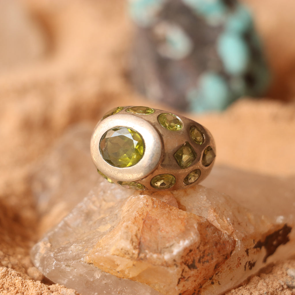 SILVER RING FEATURING MULTIPLE PERIDOTS