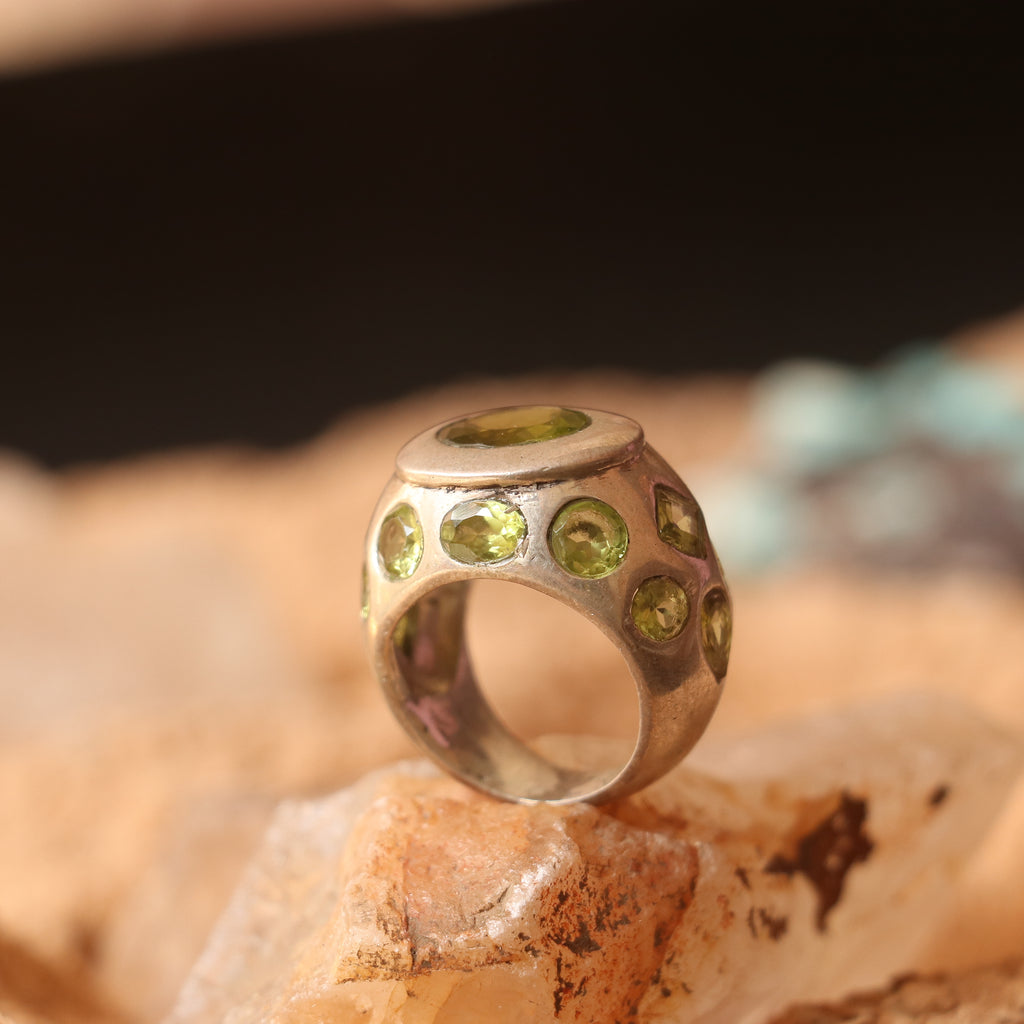 SILVER RING FEATURING MULTIPLE PERIDOTS
