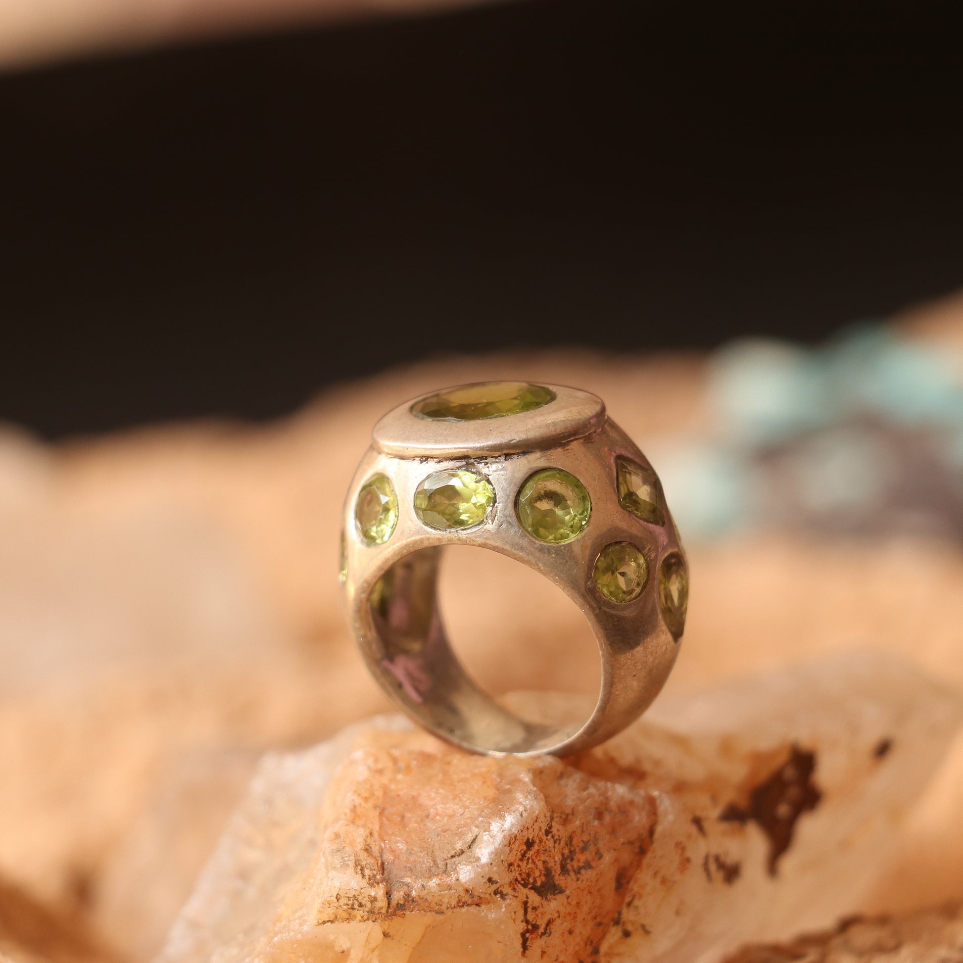 SILVER RING FEATURING MULTIPLE PERIDOTS