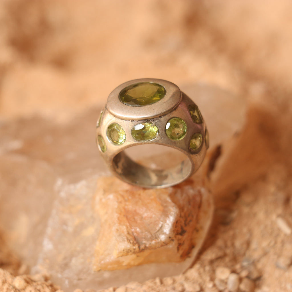 SILVER RING FEATURING MULTIPLE PERIDOTS