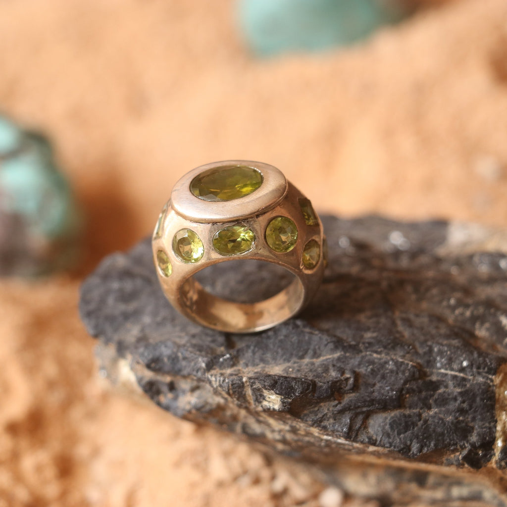 SILVER RING FEATURING MULTIPLE PERIDOTS