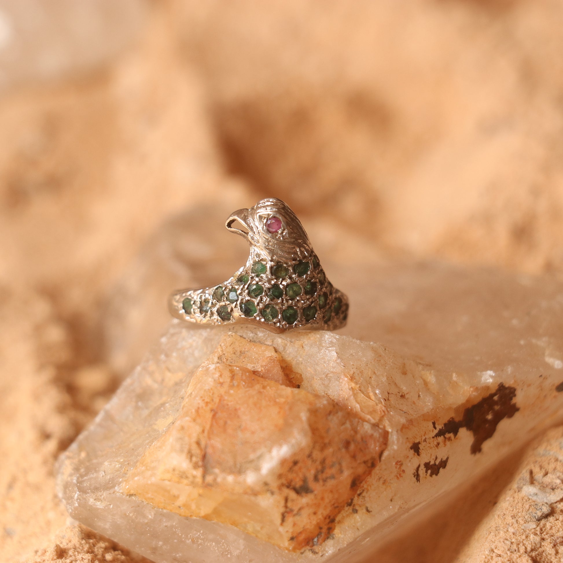SILVER EAGLE SHAPED RING WITH EMERALDS & A SMALL RUBY EYE