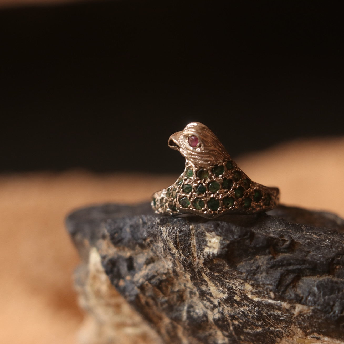 SILVER EAGLE SHAPED RING WITH EMERALDS & A SMALL RUBY EYE