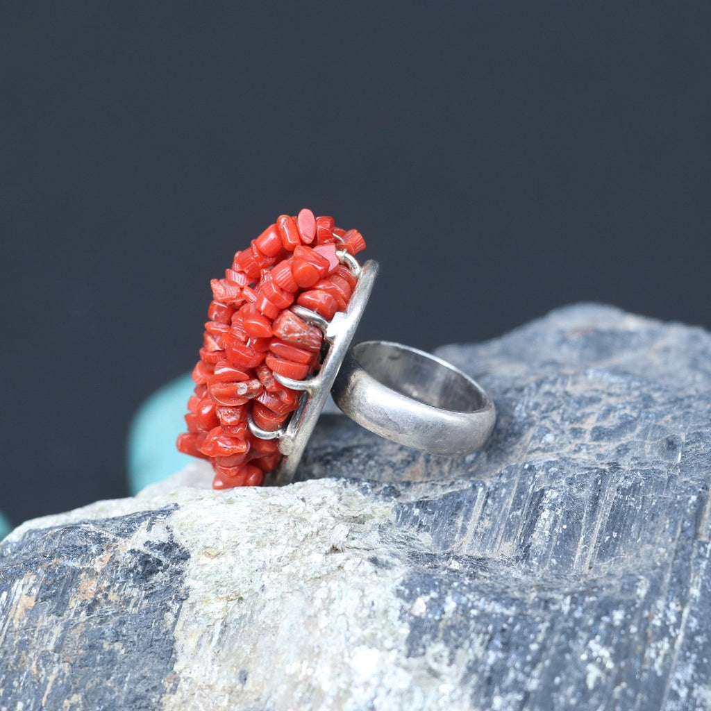 CHUNKY SILVER RING ADORNED WITH A CLUSTERED RED CORAL BEEDS