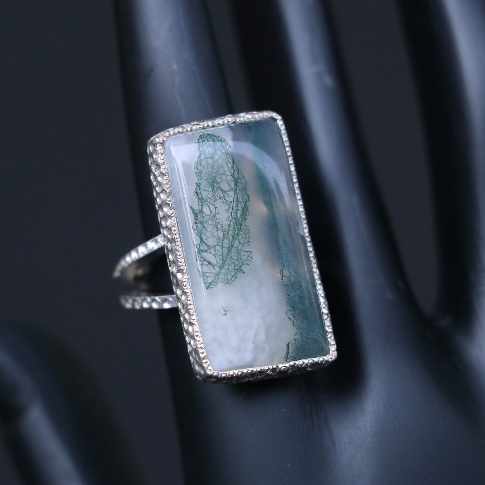 Silver ring showcasing a large rectangular moss agate stone