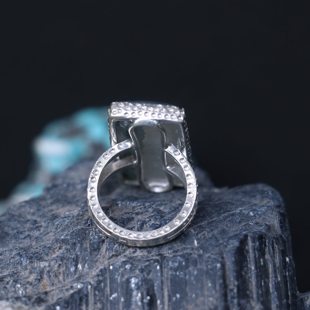 Silver ring showcasing a large rectangular moss agate stone