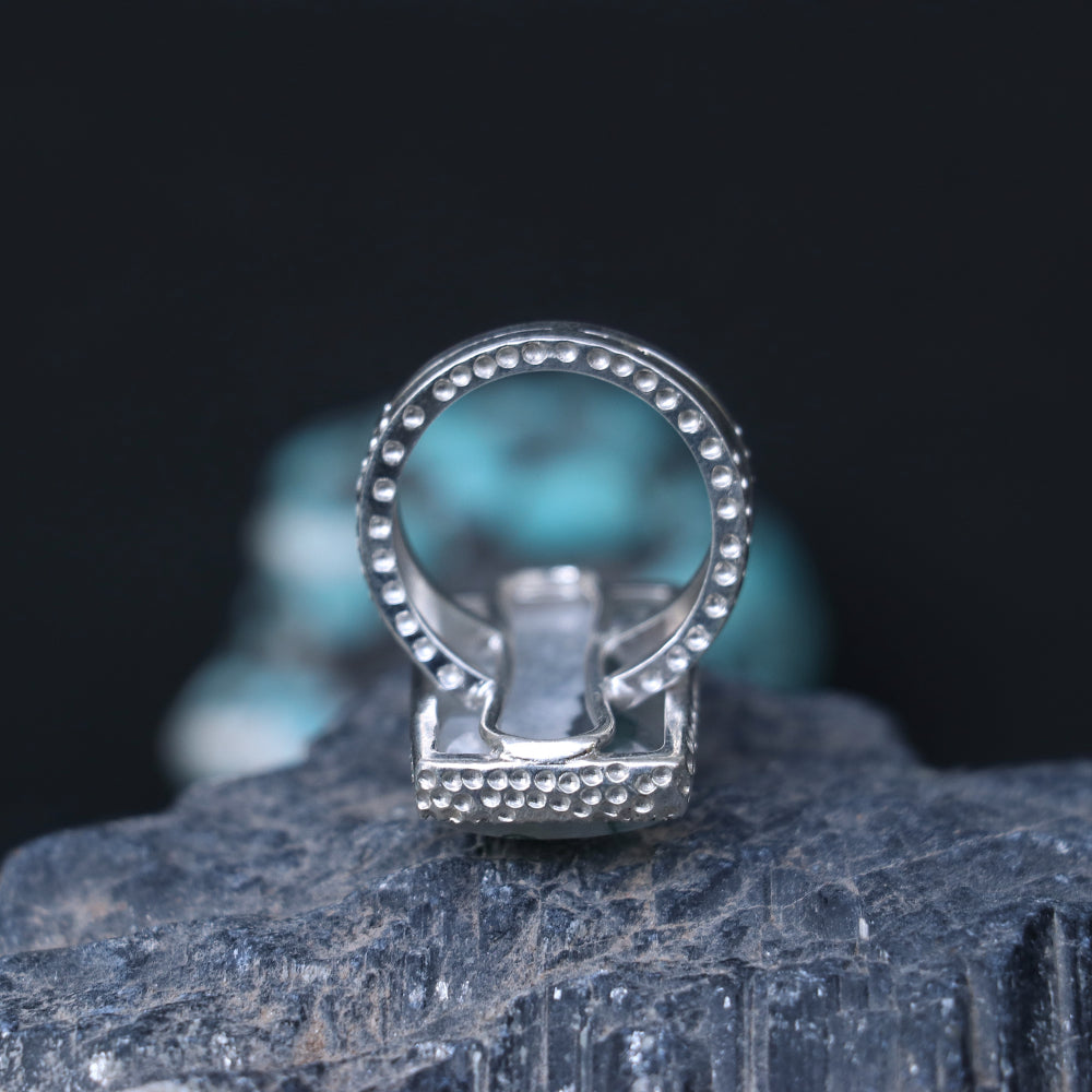 Silver ring showcasing a large rectangular moss agate stone