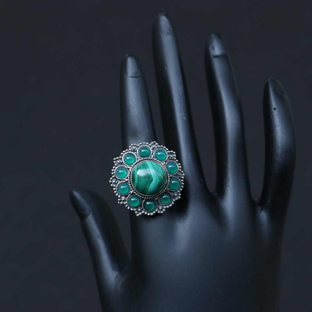SILVER RING WITH A ROUND MALACHITE STONE WITH SMALL ONYX GREEN STONES
