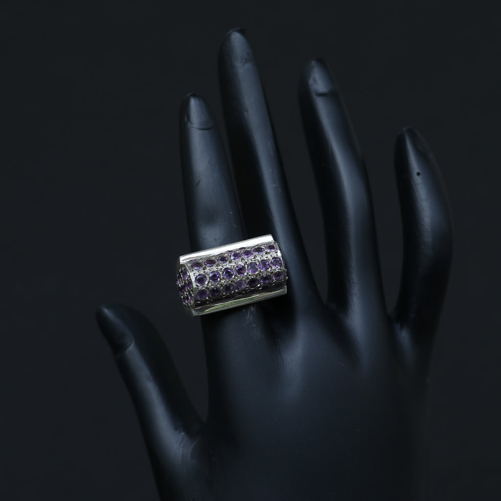 SILVER RING SET IN SMALL AMETHYSTS