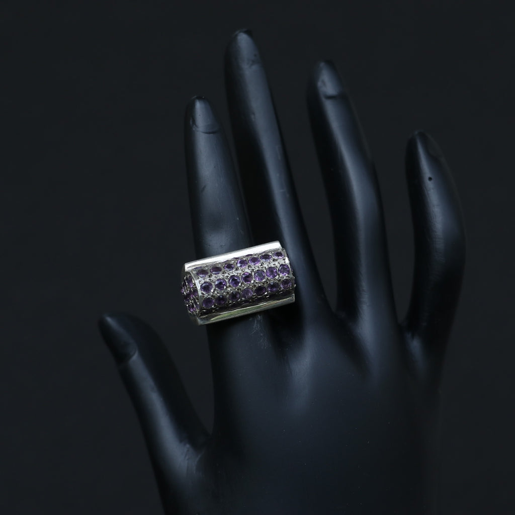SILVER RING SET IN SMALL AMETHYSTS