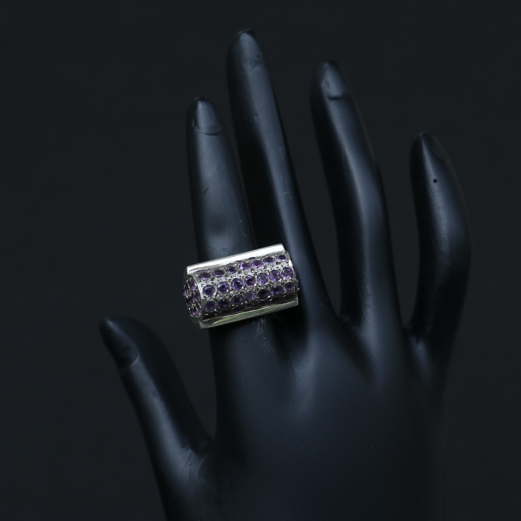 SILVER RING SET IN SMALL AMETHYSTS