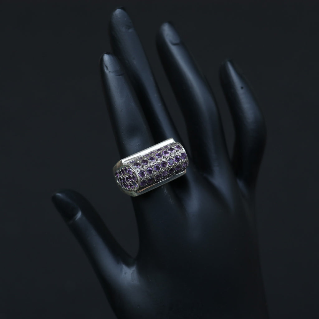 SILVER RING SET IN SMALL AMETHYSTS