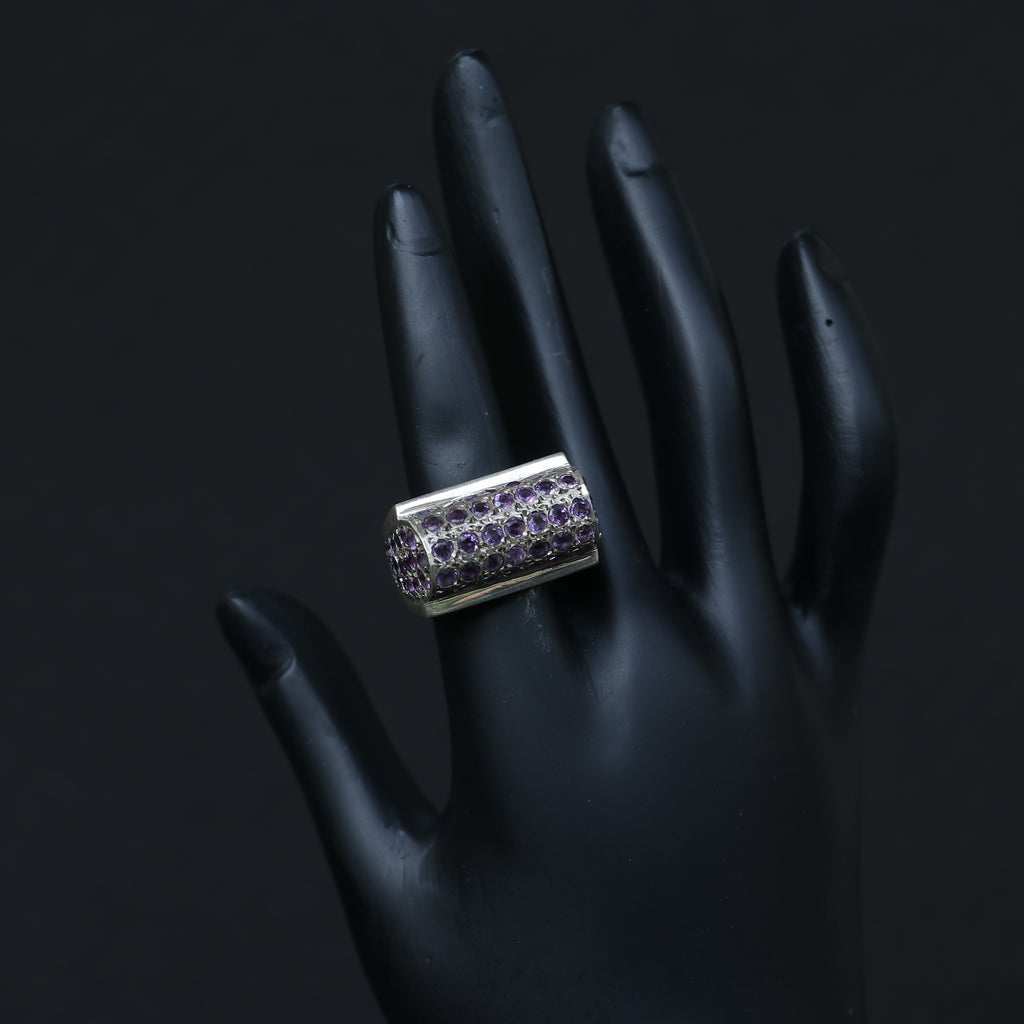 SILVER RING SET IN SMALL AMETHYSTS